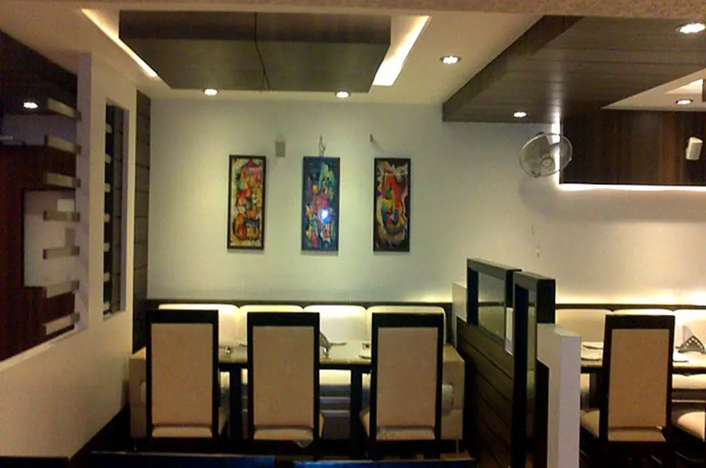 Dining area with paintings